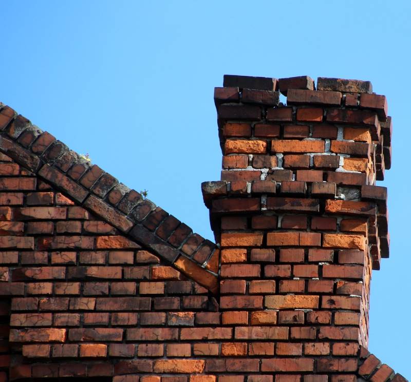 Signs Your Melvindale Home Needs a Chimney Inspection Damaged chimney on an Melvindale home showing cracks and missing mortar